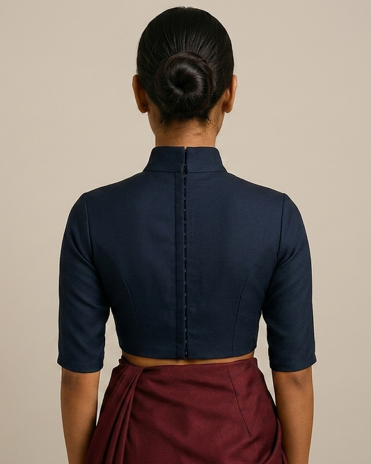 High‑neck blouse with structured neckline, fitted bodice back view